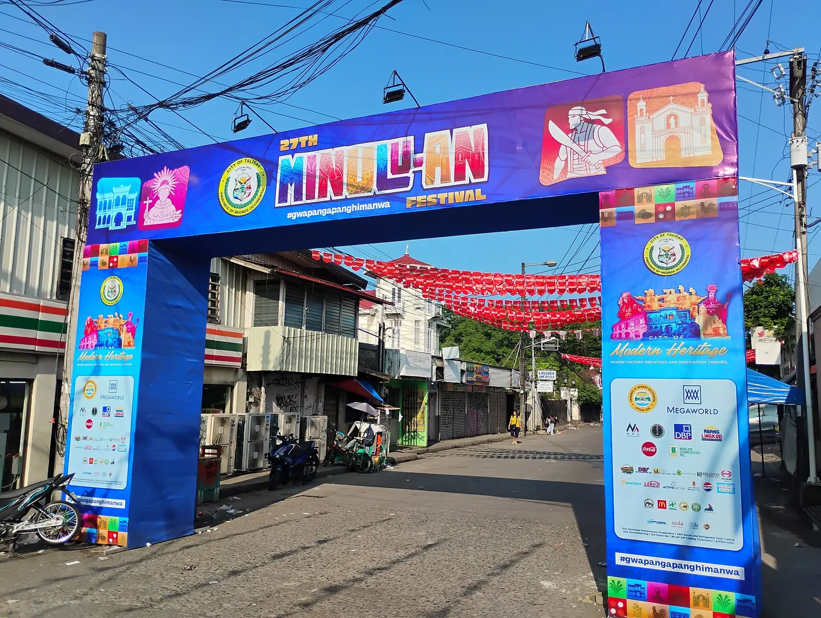 The 27th Minulu-an Festival arch in Talisay. The Commons file is dated September 2025