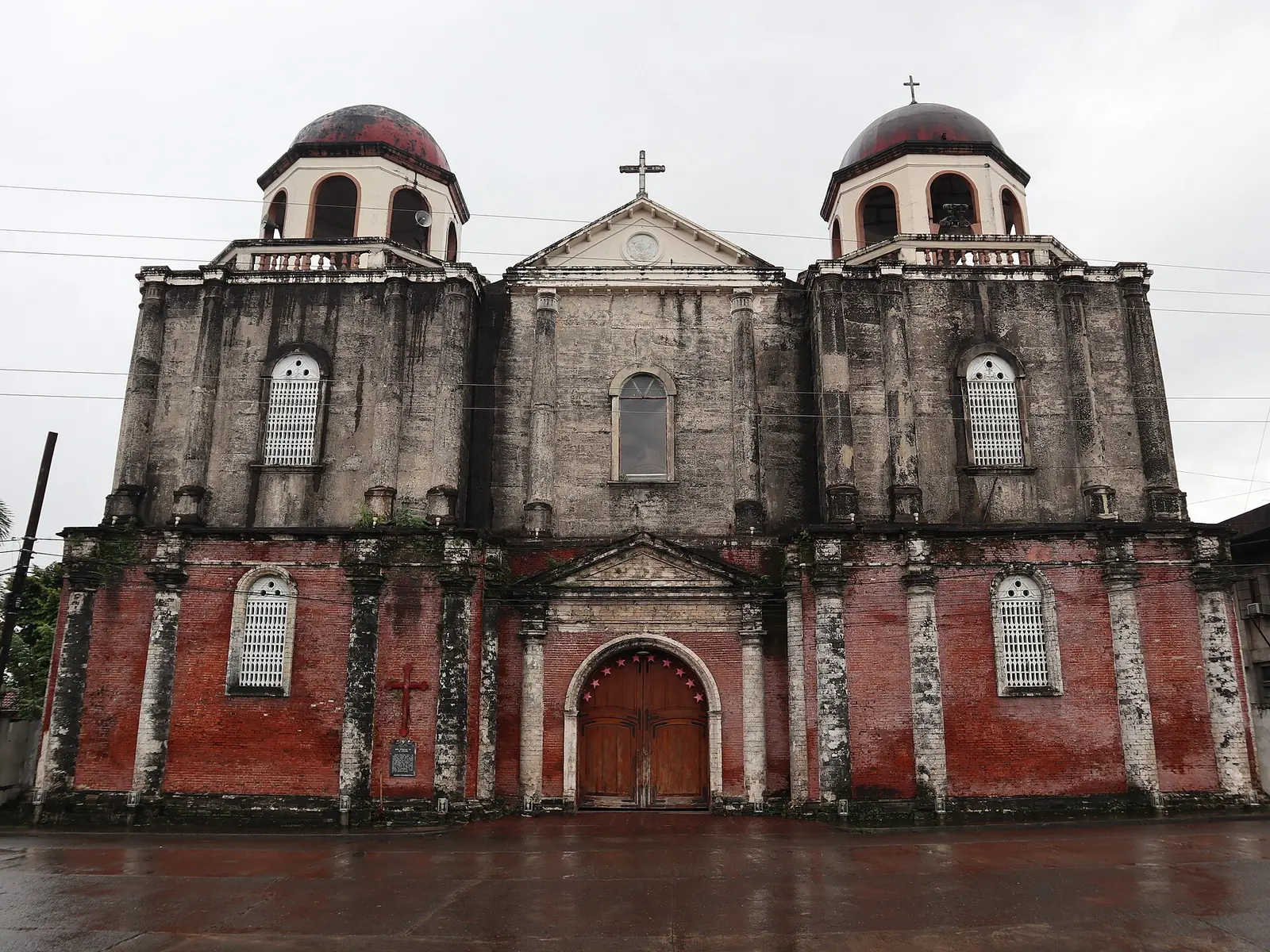 Nuestra Señora de La Paz Church in La Carlota, a stone church with a dome and a bell tower