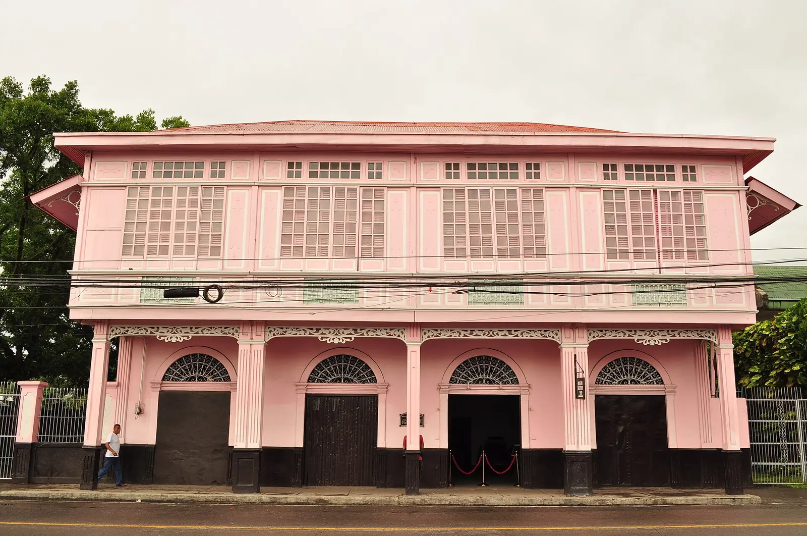 The Bernardino Jalandoni Museum, a pink ancestral house with a red roof in Silay