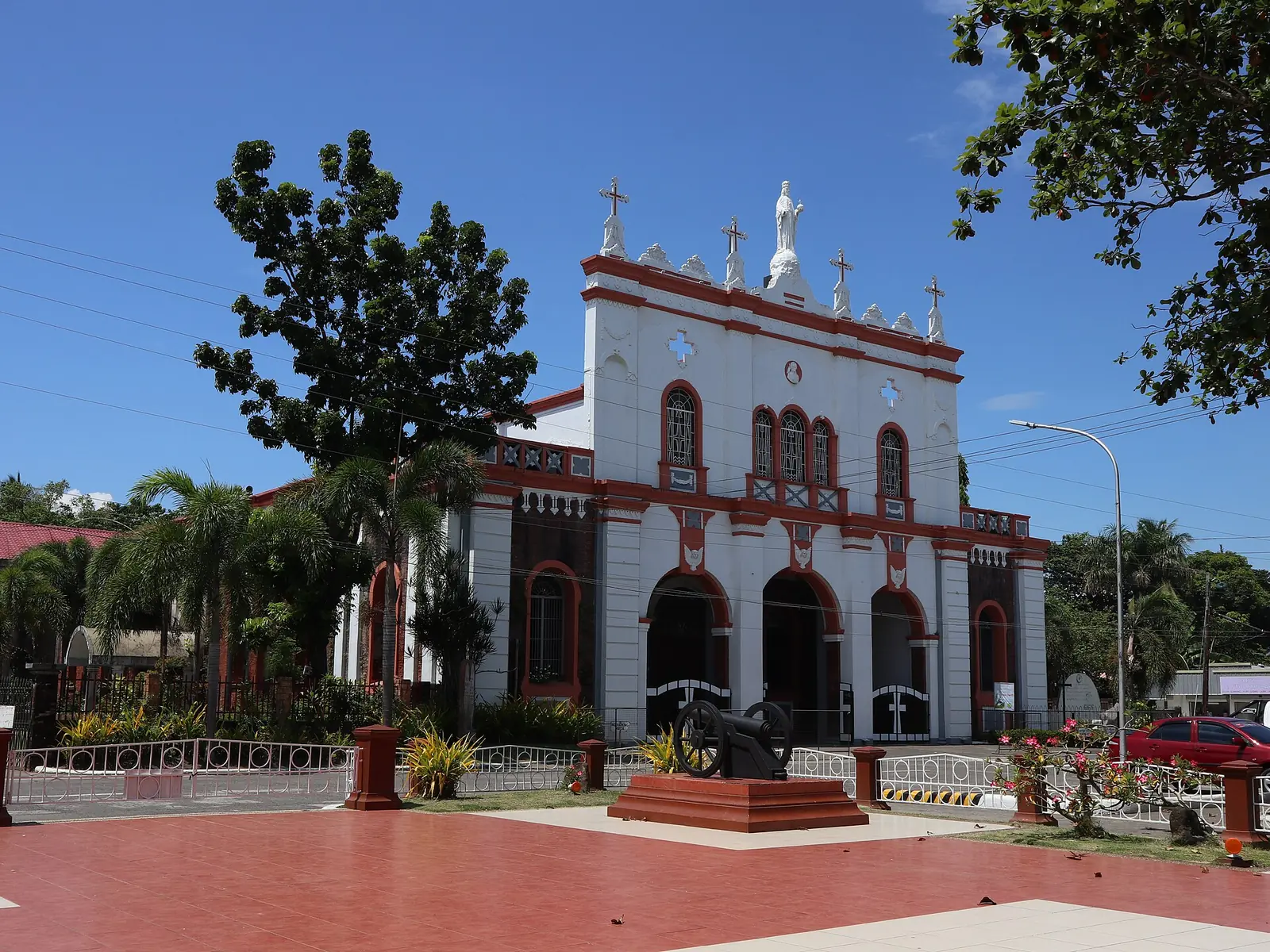 St. John the Baptist Church in Bago, a coral-brick church with a bell tower