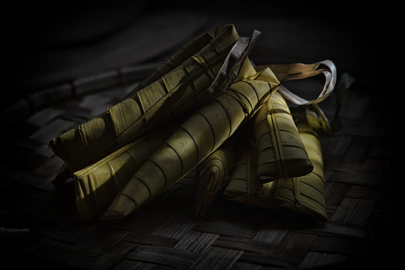 Suman sa ibos, sticky rice cooked in coconut milk and wrapped in palm leaves