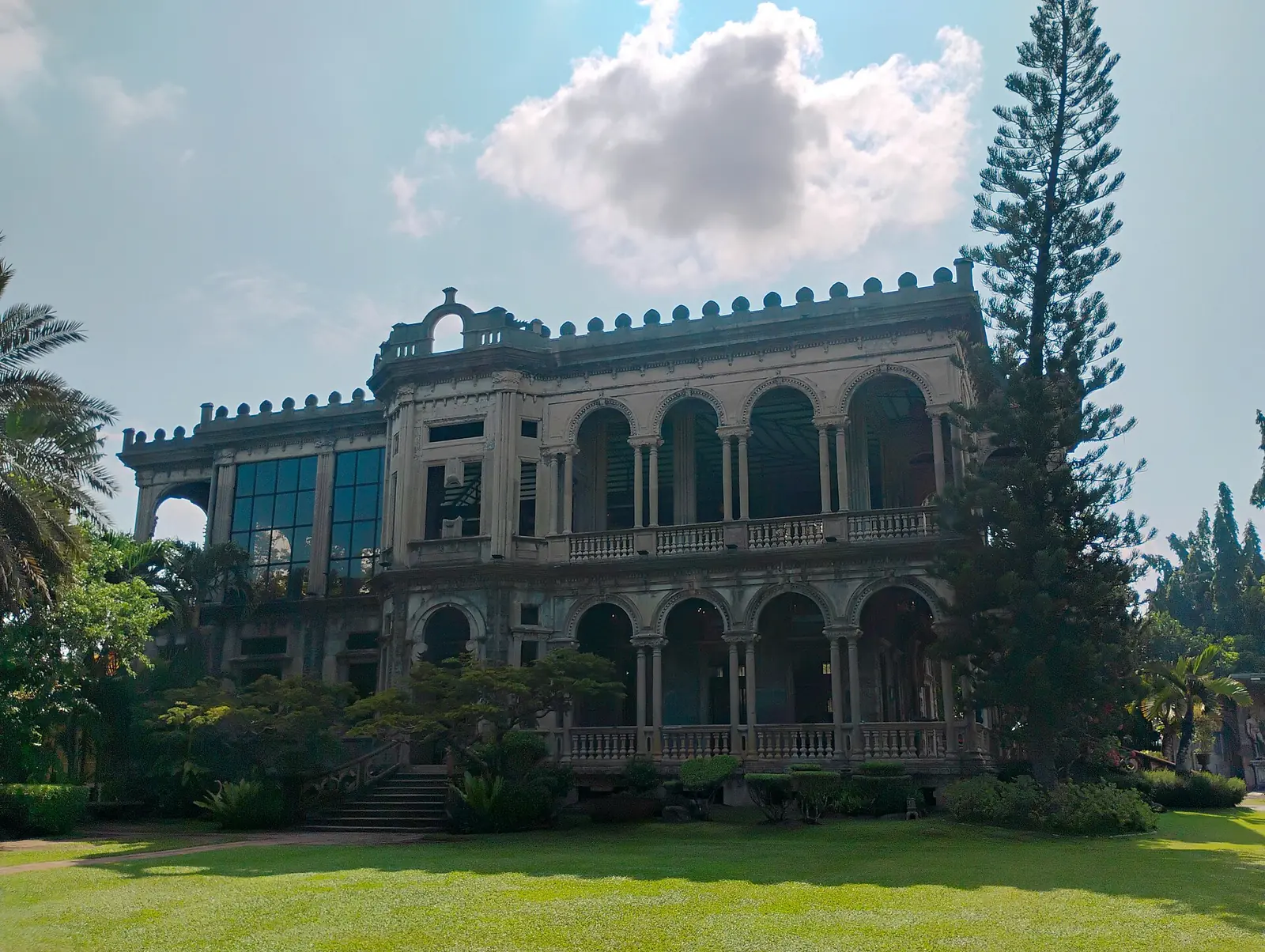 The Ruins in Talisay, the stone skeleton of a mansion with arches, in daylight
